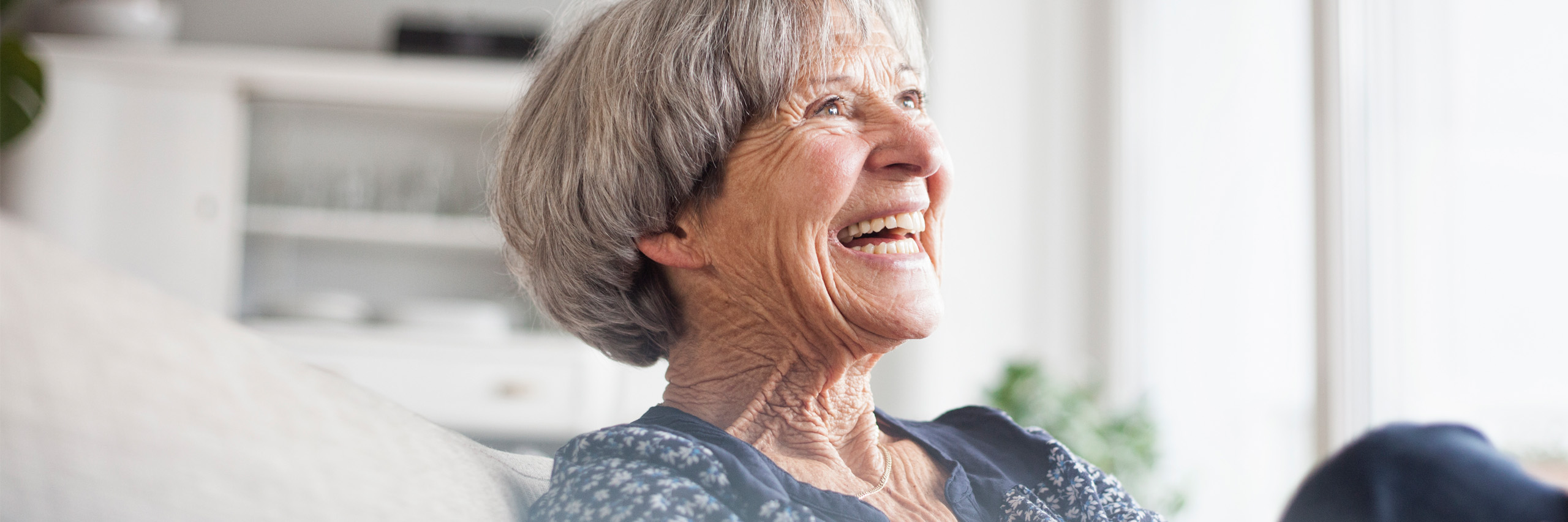 Image of older lady smiling with soft and sharp focus